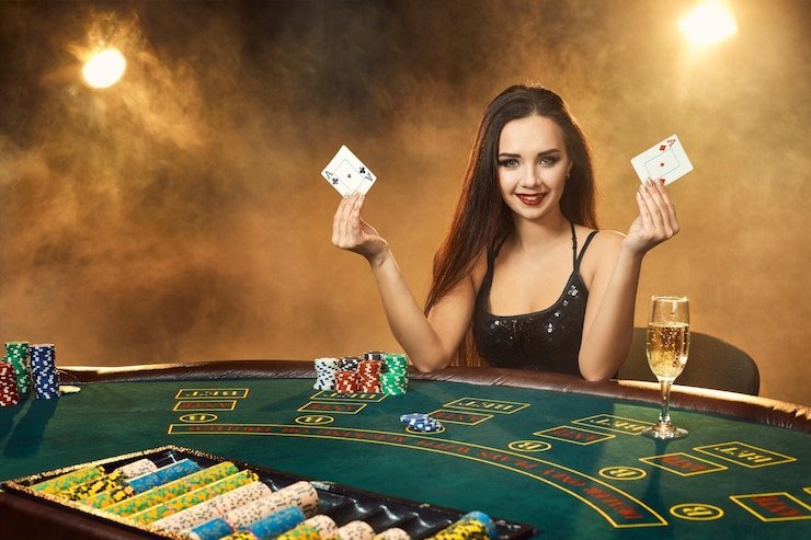 menang club UFC live-dealer studio with HD camera setup and dealer at blackjack table